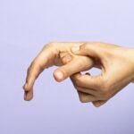 The Amazing New Era of Pressure Point Therapy Applying thumb pressure to a pressure point between the thumb and index finger.